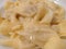 casoncelli or tortelli with poured butter and sage. Italian pasta.