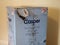 Casper home mattress delivery box inside home. Weathered and damaged from shipping and freight