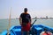 Caspian Sea, Iran - May 25, 2017: A male captain of a small boat prepares to carry tourists