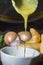 Cassava broth in a white bowl, ingredients on the side, copy space and dark background