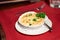 Casserole with a golden crust, mushroom julienne with baked cheese, creamy gratin. Delicious julienne with cheese in clay pot with