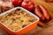 Casserole with potatoes, sausages, tomatoes and cheese.