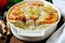 Casserole with rice, sea bass, tomato