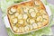 Casserole with zucchini, corn and potato in baking dish