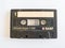 Cassette tape, object isolated on a white background, analog magnetic tape for audio recording, outdated technology