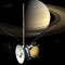 Cassini mission orbiter satellite passing Saturn