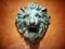 Cast green metal lion head