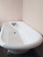 Cast iron claw foot bath tub in a clean, white bathroom