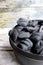 Cast Iron Dutch Oven Briquettes With Wooden Background