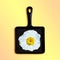 Cast-iron frying pan with fried eggs, flower of rudbeckia instead of yolk