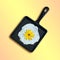 Cast-iron frying pan with fried eggs, flower of topinambur instead of yolk