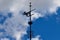 Cast iron wind vane and blue skies