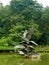 Cast metal statue of swans flying