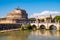 Castel Sant`Angelo mausoleum - Castle of the Holy Angel and Ponte Sant`Angelo bridge over Tiber river in Rome in Italy