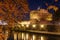 Castel Sant Angelo or the Mausoleum of Hadrian and Tiber River, at night - landmark attraction in Rome, Italy. Autumn background