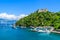 Castello Brown at Portofino, Italy - Harbor town with colorful houses and yacht in little bay. Liguria, Genoa province, Italy.