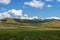 Castelluccio di Norcia, in Umbria, Italy. Fields and hills, sunny day. Green agricultural rural landscape. With bales of