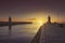 Castiglione della Pescaia, red and blue lighthouses at sunset. Maremma Tuscany, Italy