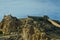 The Castillo de Santa BÃ¡rbara in Alicante on a rocky mountain under a clear blue sky