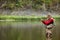 Casting angler catches fish in the river