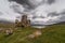 Castle Ardvreck ruins under storm sky, Scotland.