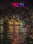 Castle Brown with the christmas lights in Portofino by night and the sailing yachts