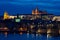 Castle and Charles Bridge by night in Prague