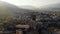 Castle of Gjirokastra and old city center. Aerial view of ancient fortress, houses and mountains in Gjirokaster, Albania