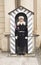 Castle Guard standing guard in his sentry Box at Prague Castle.