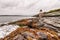 Castle Hill Lighthouse in Newport, Rhode Island, situated on a dramatic rocky coastline