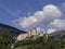 Castle on a hill in a sunny day with blue sky with clouds, Lienz, Austria