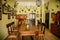 Castle interior, Baroque and renaissance furniture, bureau with swing doors, wooden carved table and chairs, hunting salon with
