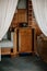 Castle interior bedroom, Secession art nouveau style, Black Telephone, retro disk dialer, wood carved white canopy bed renaissance