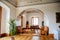 Castle interior, Ceiling arch, leather sofas for guests, grand piano in living room, large hall, ceiling baroque stucco,