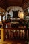 Castle interior, vintage wooden balustrade, billiard room with hunting trophies, bear skin, deer heads with antlers, wood carved