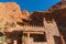 Castle kasbah hotel on the high Cliff in amazing place at Picturesque Serpentine mountain road in Gorges Dades in high