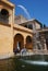 Castle of the Kings Pool and water spout, Seville, Spain.