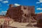 Castle and old houses encircling square with pillory