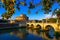 Castle Sant Angelo Mausoleum of Hadrian, bridge Sant Angelo and river Tiber in the rays of sunset in Roma