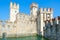 Castle of Scaligers on shore of Lake Garda in resort town of Sirmione, Italy