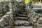 Castle staircase with walls made of rocks, historical looking architecture