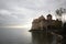 Castle at Switzerland and wonderful lake, travel destination at Lake Geneve, ancient historical landmark brick stone medival