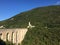 Castle and viaduct in wooded gorge in Umbria Italy