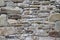 Castle wall stone grunge texture background. Grungy vintage fortress granite and sandstone. Rough old stone or rock of mountains