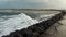 Castlerock Northern Ireland. Beautiful ocean wave breaking on the background of land