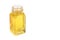 Castor oil in glass bottle on white background