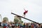 CASTRO URDIALES, SPAIN - JUNE 29: Unidentified girl falls from the greasy pole to the sea in the festival celebrated in June 29, 2