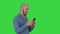 Casual arabic businessman using the phone and smiling on a Green Screen, Chroma Key.