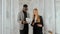 Casual business meeting of business people, discussion of documents. Black man and blonde woman in business suits in the