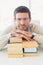 Casual businessman with books at his desk